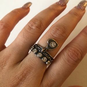 Solid sterling silver ring with head charm